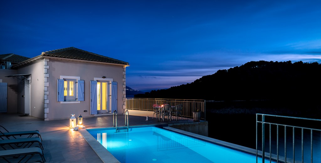 Mood lighting and an infinity pool ready for an evening swim at Villa Plori, Assos, Kefalonia