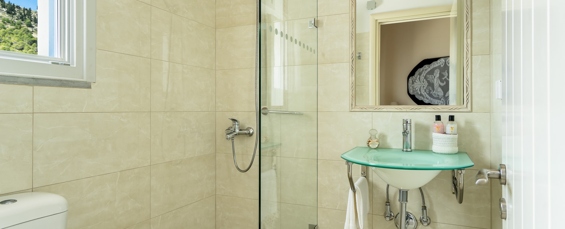 Bathroom with shower and basin at Villa Plori, Assos, Kefalonia