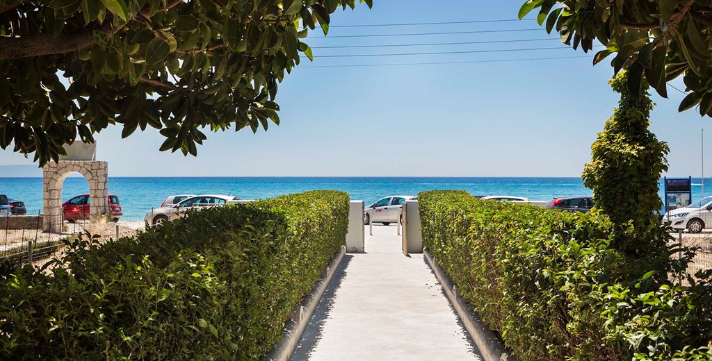 Lined path to the sea outside Beachfront Suites, Lourdata, Kefalonia