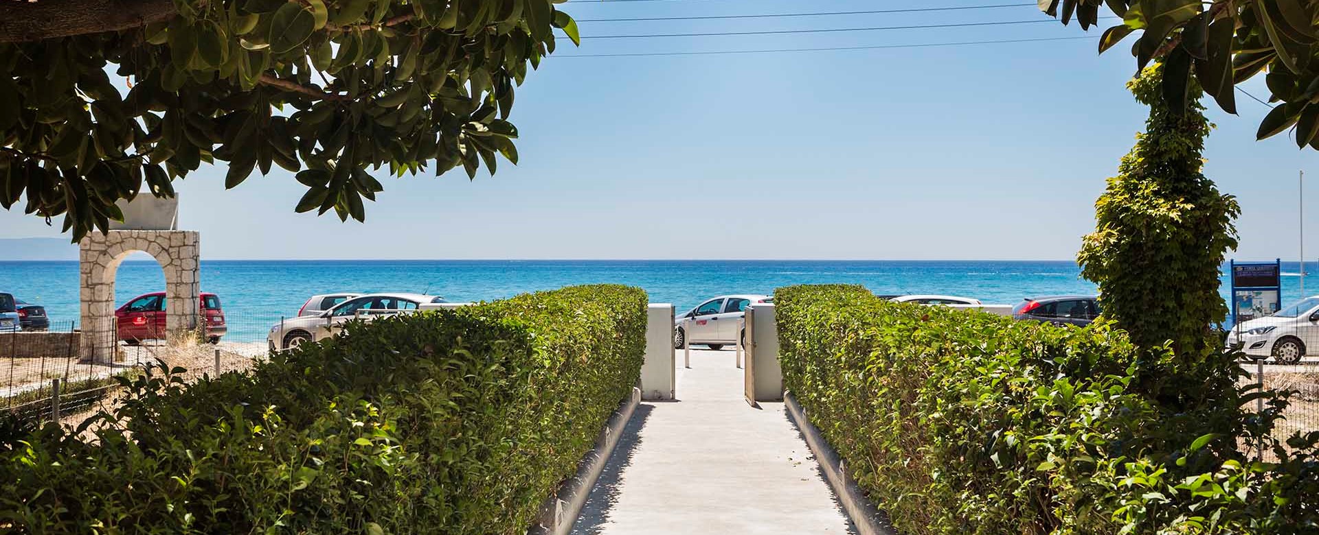 Lined path to the sea outside Beachfront Suites, Lourdata, Kefalonia