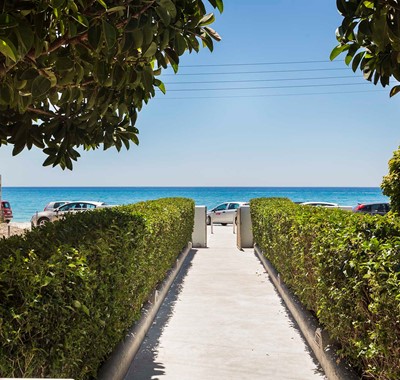 Lined path to the sea outside Beachfront Suites, Lourdata, Kefalonia