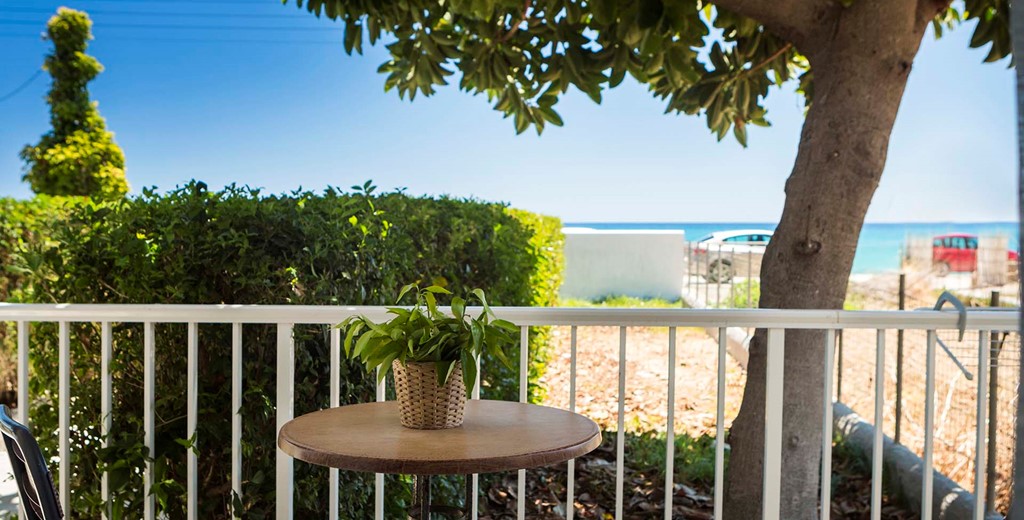 Escape the sun and drink or dine al fresco in the shade outside Beachfront Suite No1, Lourdata, Kefalonia