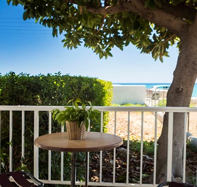 Escape the sun and drink or dine al fresco in the shade outside Beachfront Suite No1, Lourdata, Kefalonia