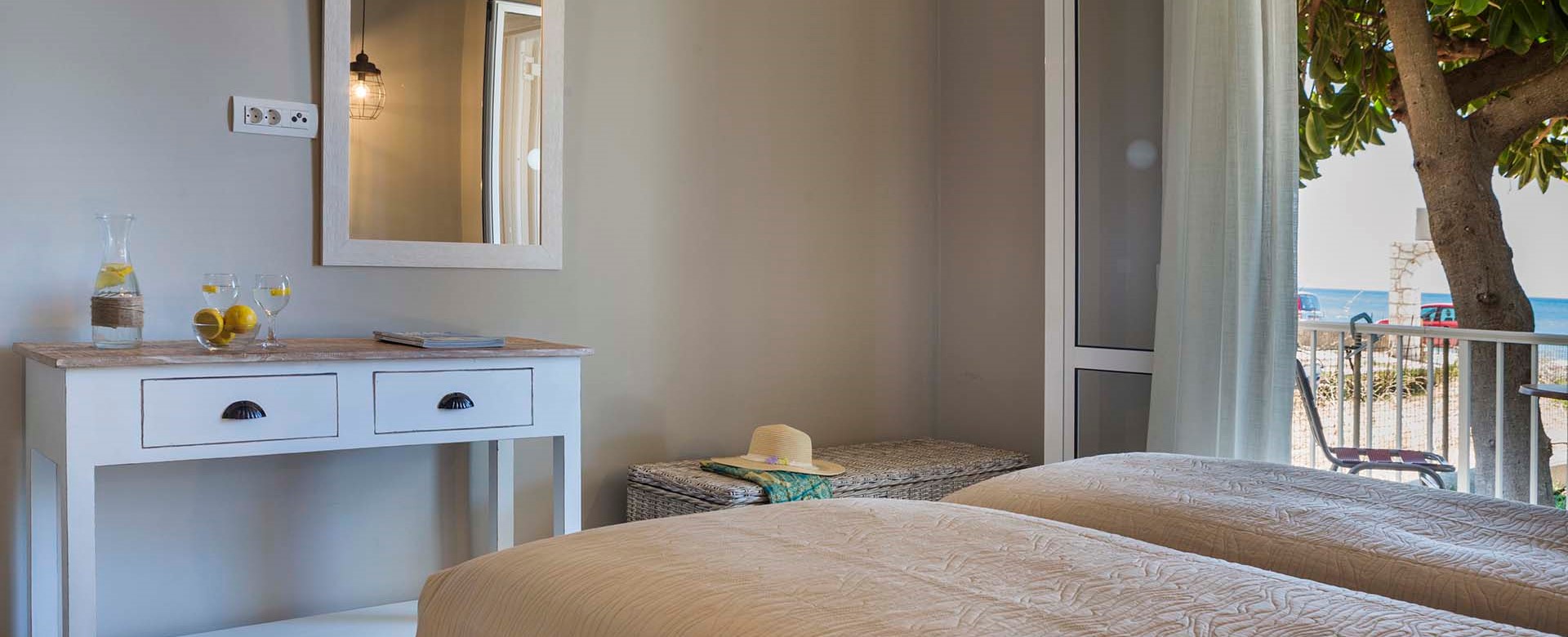 Plenty of room to get ready for the day inside the bedroom at Beachfront Suite No2, Lourdata, Kefalonia