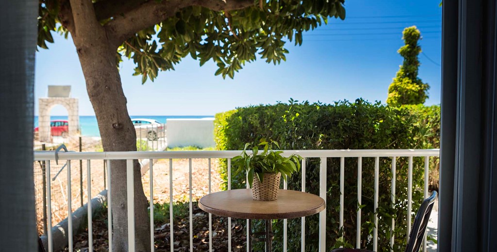 Escape the sun and drink or dine al fresco in the shade outside Beachfront Suite No2, Lourdata, Kefalonia