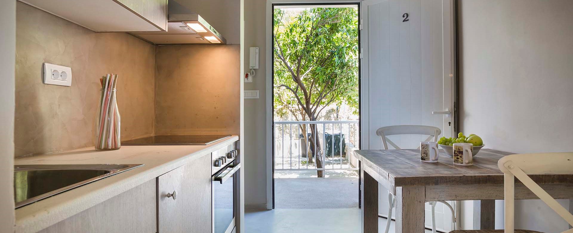 Kitchen, dining andmain entrance to Beachfront Suite No2, Lourdata, Kefalonia