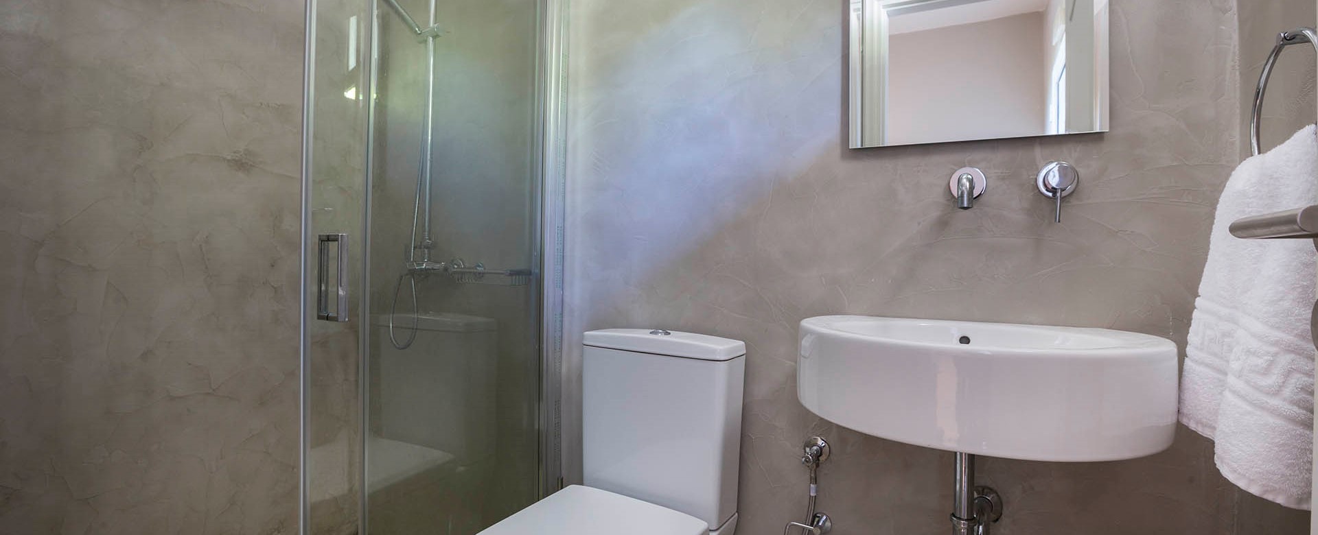 Bathroom with shower and basin inside Beachfront Suite No2, Lourdata, Kefalonia