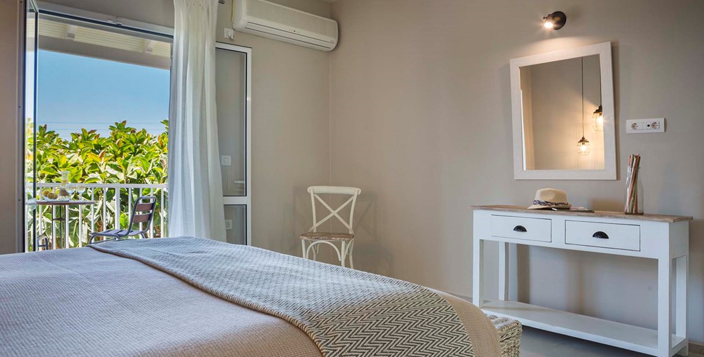 Bedroom with double bed and plenty of space to prepare for the day or evening inside Beachfront Suite No3, Lourdata, Kefalonia