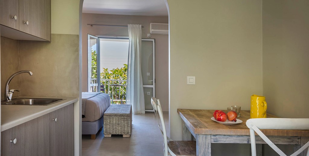 Dining, kitchen space looking through the bedroom to the sea views from Beachfront Suite No3, Lourdata, Kefalonia