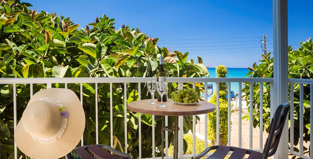 Private treetop balcony for lunch or dinner with a view of the mediteranean sea at Beachfront Suite No4, Lourdata, Kefalonia