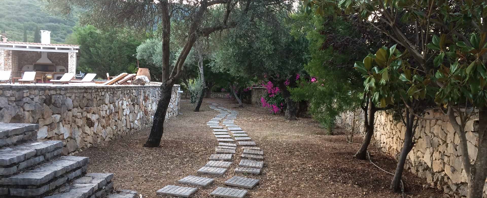 Stroll through the gardens of Melissani Apartments, Karavomilos, Kefalonia, Greek Islands