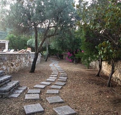 Stroll through the gardens of Melissani Apartments, Karavomilos, Kefalonia, Greek Islands
