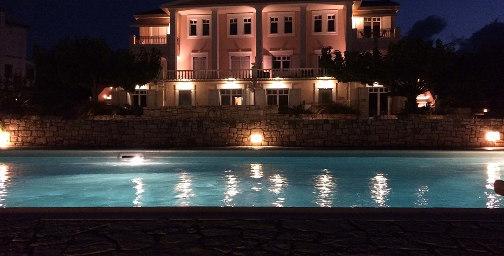 Evening lighting turns the Melissani Apartments into a stunning backdrop for you holiday in Kefalonia