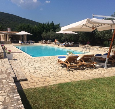 Pool sun loungers and mountain views at Casa Angela, Melissani Apartments, Karavomilos, Kefalonia, Greek Islands