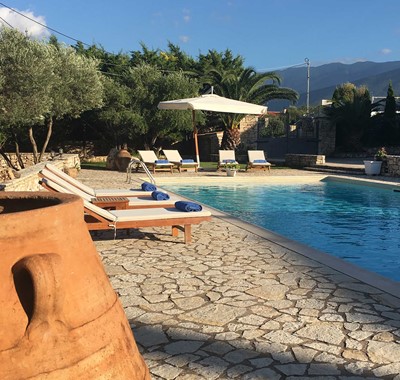 Sun beds beside the pool prepared for another great holiday in Casa Elena, Melissani Apartments, Karavomilos, Kefalonia, Greek Islands