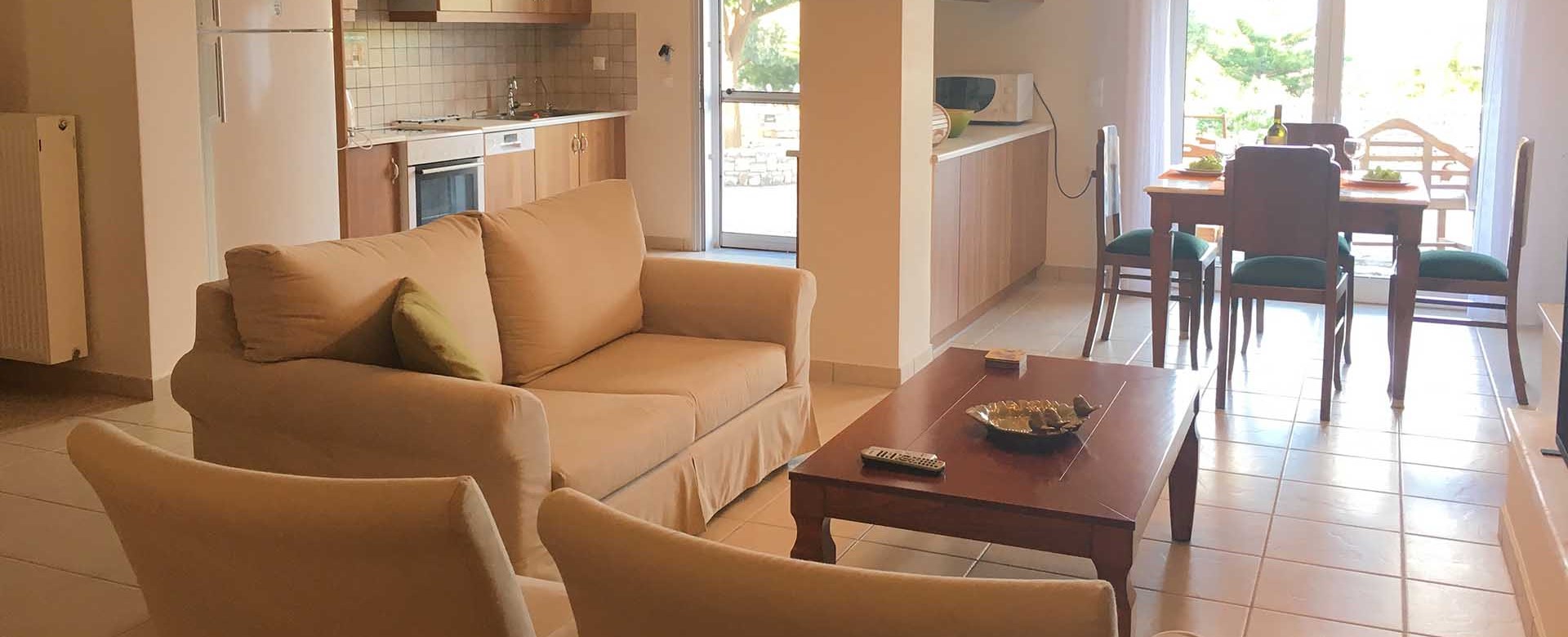 Open plan lounge kitchen and dining inside Casa Elena, Melissani Apartments, Karavomilos, Kefalonia, Greek Islands