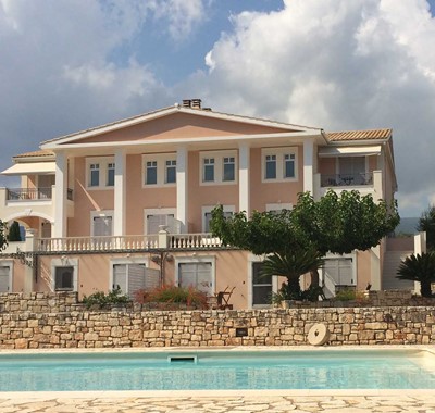 The pool and impressive Melissani Apartments in Karavomilos, Kefalonia, Greek Islands