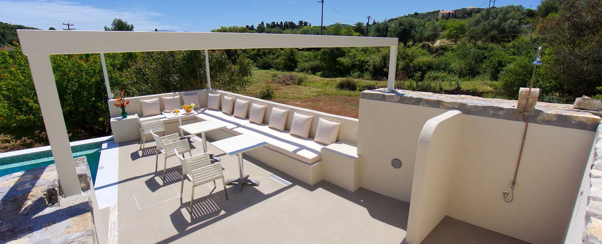 Take an easy lunch break during your holiday in the outside seating at Magnolia Apartments, Fiscardo, Kefalonia, Greek Islands