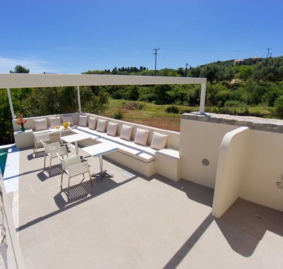 Take an easy lunch break during your holiday in the outside seating at Magnolia Apartments, Fiscardo, Kefalonia, Greek Islands