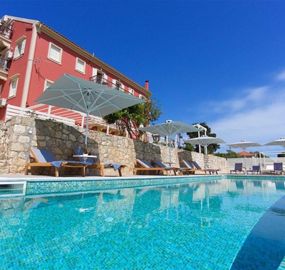 Relax in the pool and take in the sky during your holiday to Magnolia Apartments, Fiscardo, Kefalonia, Greek Islands