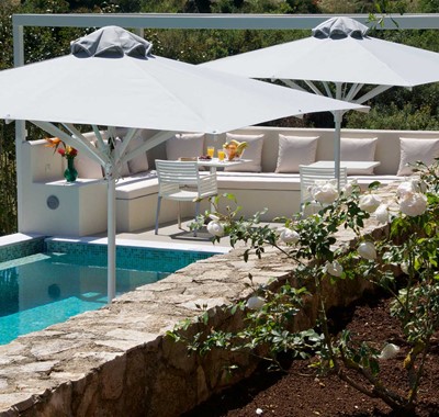 Gardens and outside seating at Magnolia Apartments, Fiscardo, Kefalonia, Greek Islands