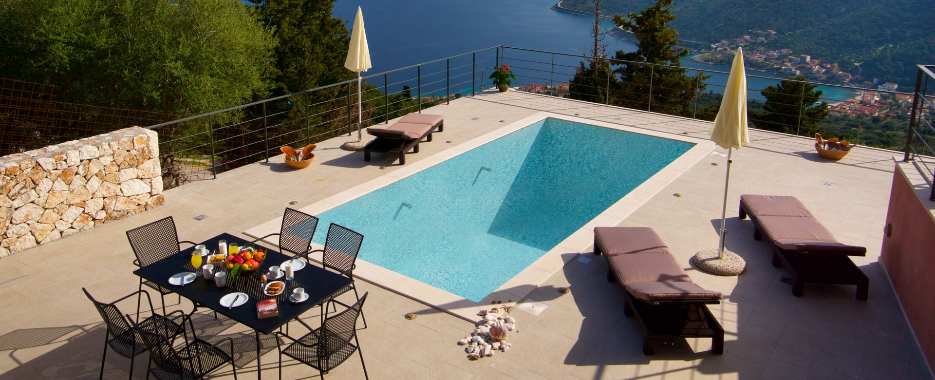 Outside dining, pool, sun beds and views outside Villa Amore, Agia Efimia, Kefalonia, Greek Islands