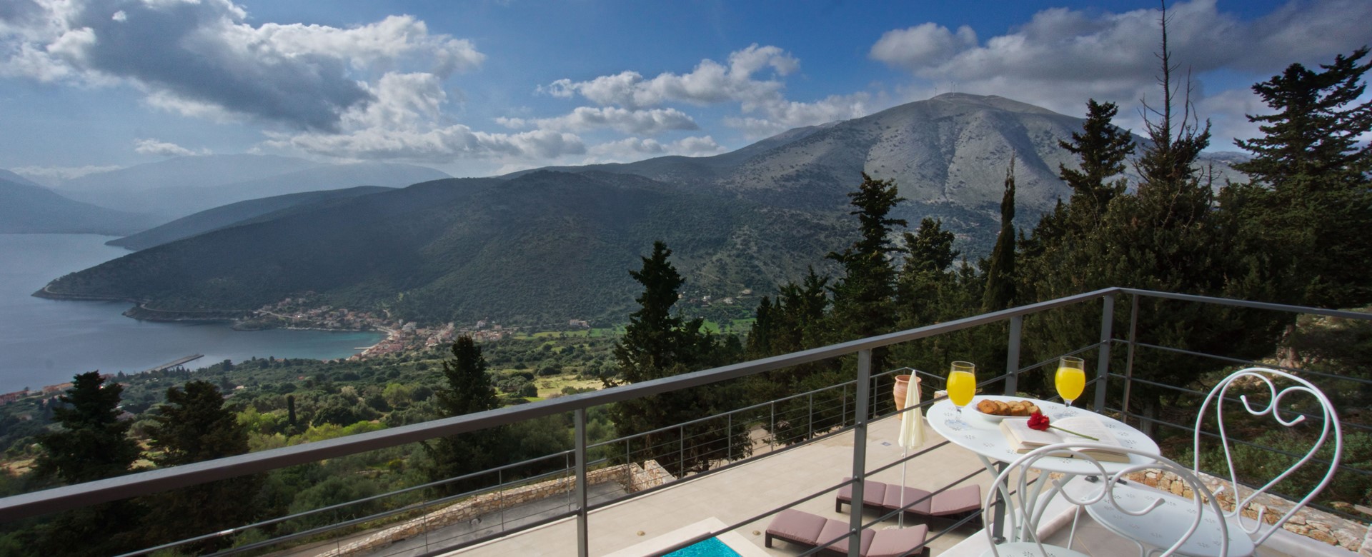 Enjoy the mountain and coastline views from the private balcony at Villa Aurora, Agia Efimia, Kefalonia, Greek Islands