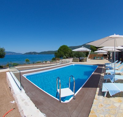 Pool sun beds and sea view outside Villa Frydi, Karavomilos, Kefalonia, Greek Islands