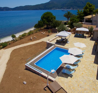 Aerial photo of the pool, patio space garden and beach at Villa Frydi, Karavomilos, Kefalonia, Greek Islands