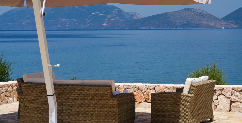 Take in the coastline views from the comfortable and shaded outside seating in Villa Frydi, Karavomilos, Kefalonia, Greek Islands
