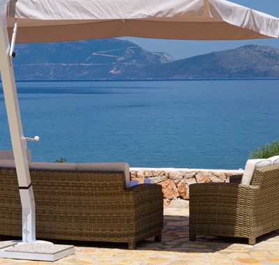 Take in the coastline views from the comfortable and shaded outside seating in Villa Frydi, Karavomilos, Kefalonia, Greek Islands
