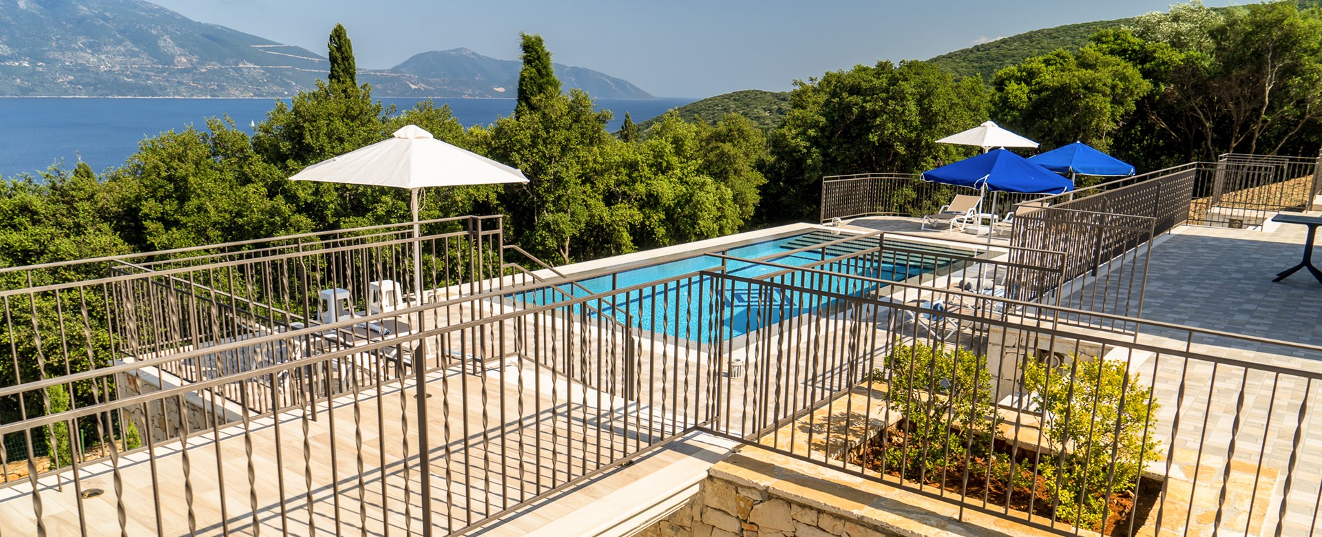 View across bridge to large private pool at Villa Gionis Fiscardo, Kefalonia, Greek Islands