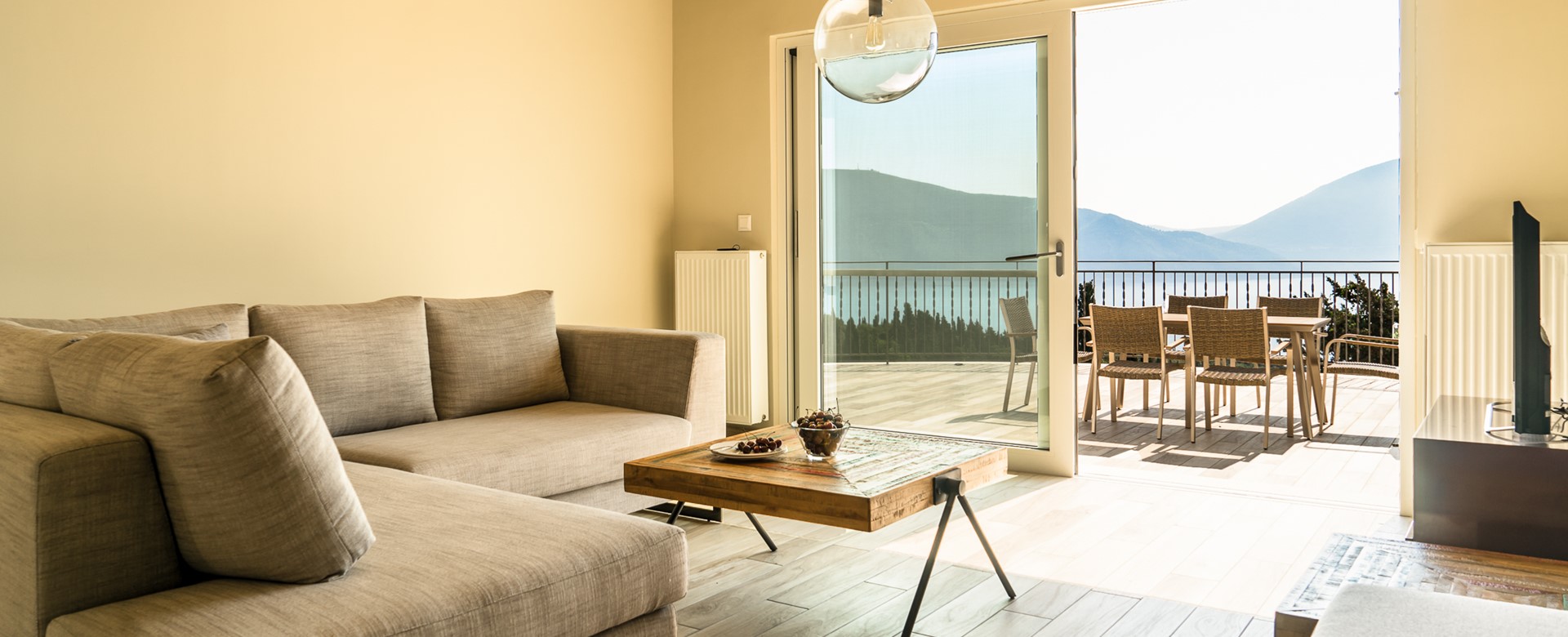Contemporary lounge with views over large terrace at Villa Gionis Fiscardo, Kefalonia, Greek Islands