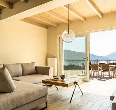 Contemporary lounge with views over large terrace at Villa Gionis Fiscardo, Kefalonia, Greek Islands