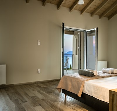Stunning mountain and sea views from bed at Villa Gionis Fiscardo, Kefalonia, Greek Islands