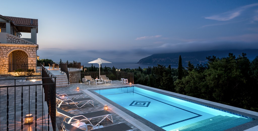 Stunning night time views across private pool to mountains at Villa Gionis Fiscardo, Kefalonia, Greek Islands