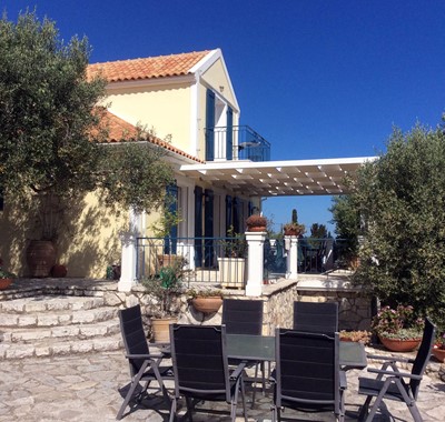 Traditional sun terrace with mature olive trees at Villa Lithia, Fiscardo, Kefalonia, Greek Islands