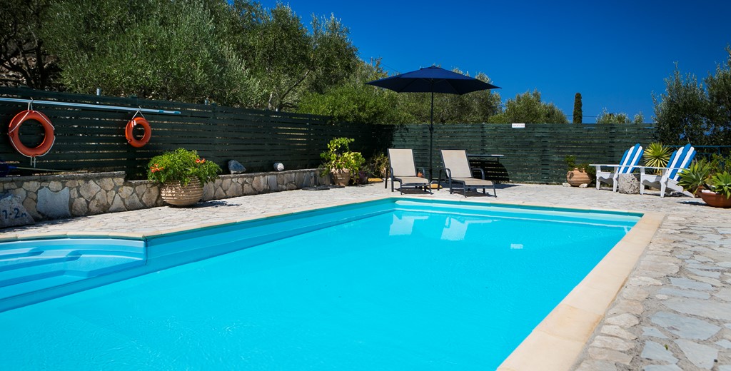 Relax poolside with umbrellas and loungers at Villa Lithia, Fiscardo, Kefalonia, Greek Islands