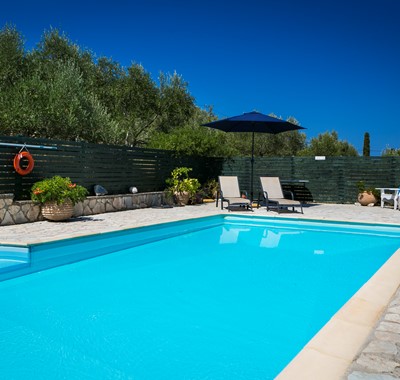 Relax poolside with umbrellas and loungers at Villa Lithia, Fiscardo, Kefalonia, Greek Islands