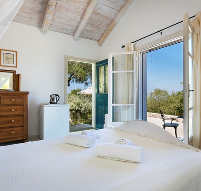 Bright and airy double bedroom with French doors to terrace at Villa Lithia, Fiscardo, Kefalonia, Greek Islands
