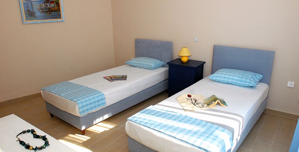 Bedroom with single beds inside Villa Panorama, Assos, Kefalonia