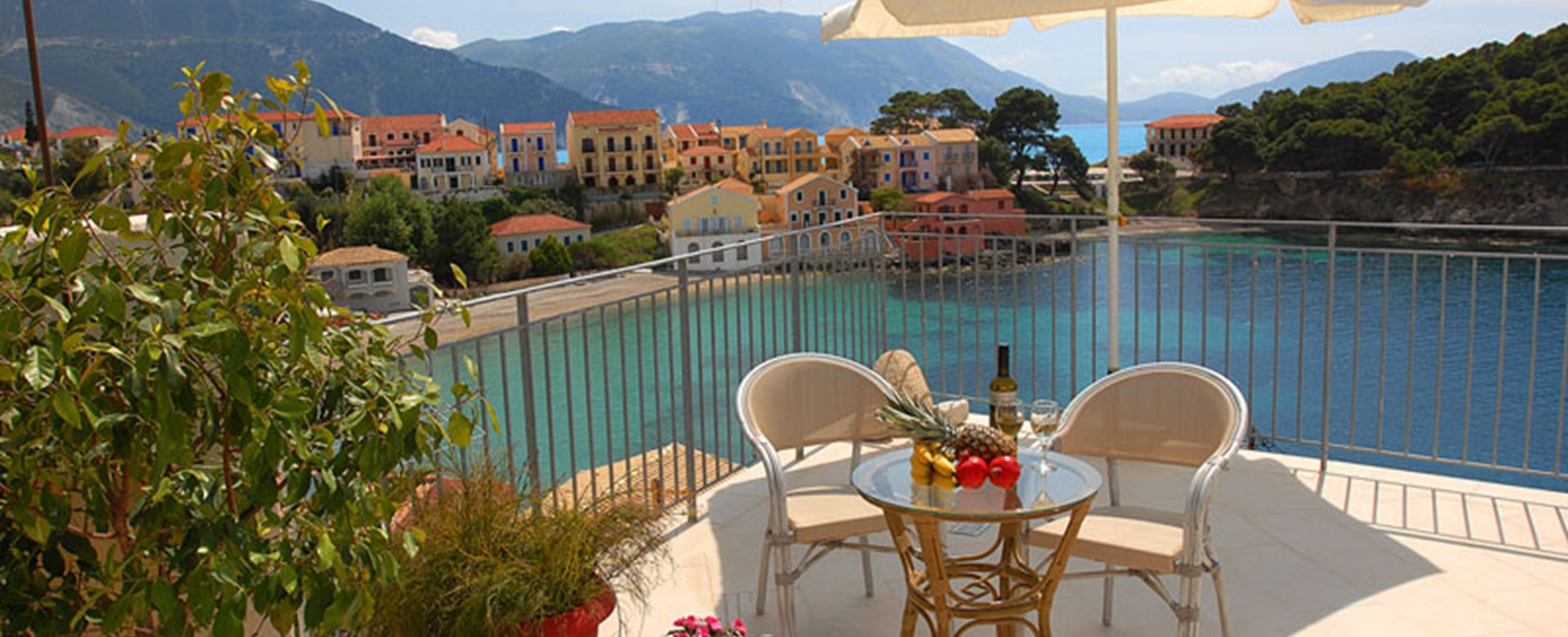 Fruit and wine make the perfect holiday lunch on the terrace outside Villa Panorama, Assos, Kefalonia