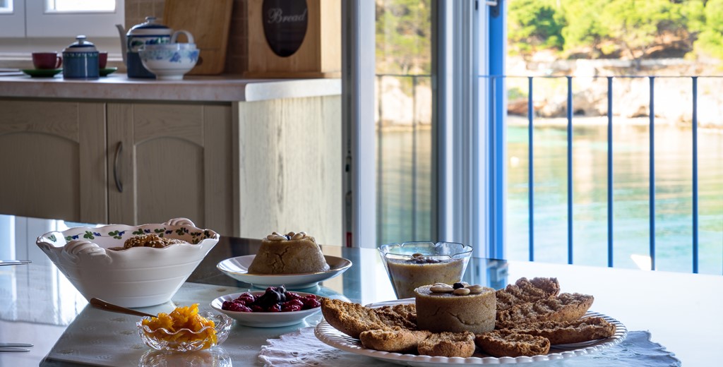 Breakfast indoors with waterfront view at Villa Petrino, Assos, Kefalonia, Greek Islands