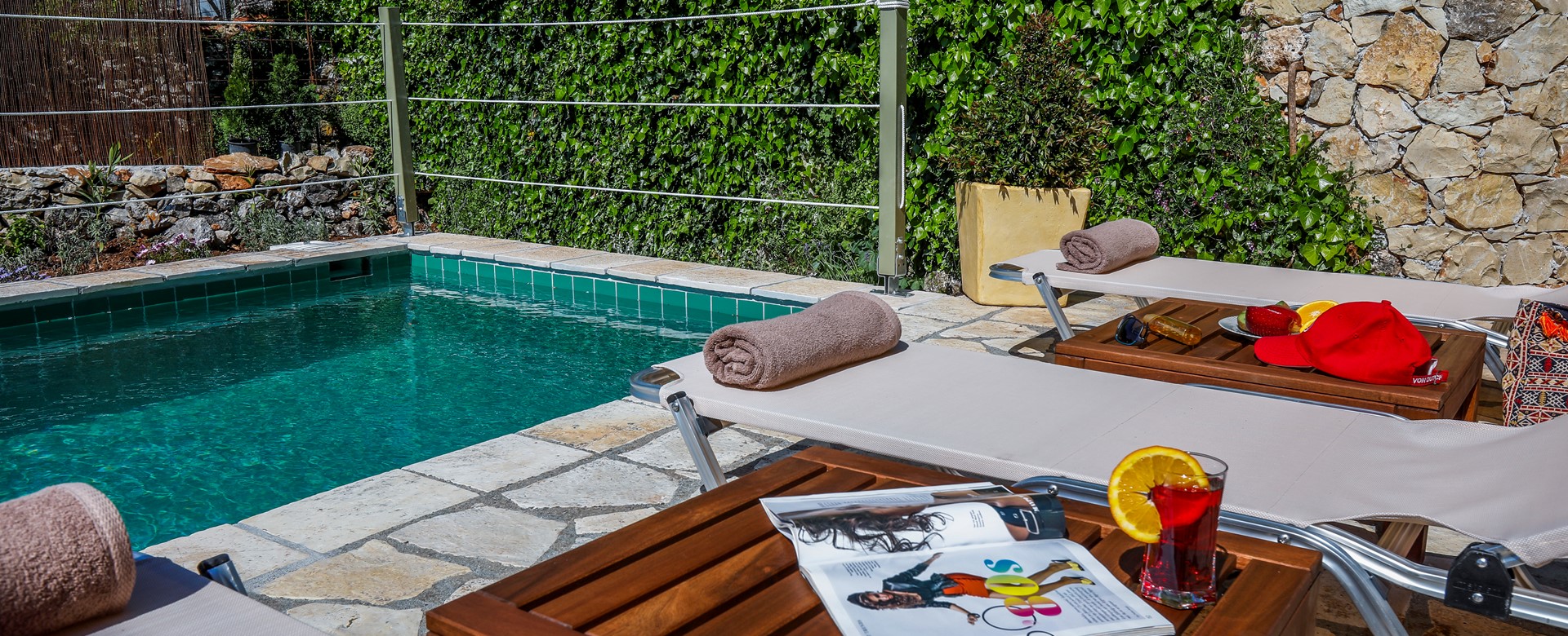 Enjoy poolside drinks on comfy sun loungers at Rosie's Herb Cottage, Assos, Kefalonia, Greek Islands