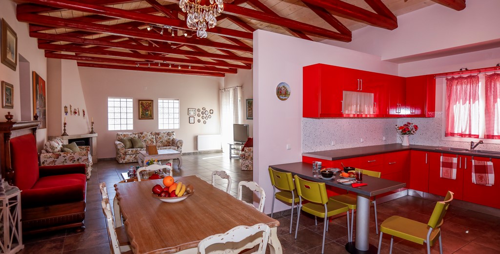 Large vaulted open plan dining area with an eclectic mix of modern and antique furniture at Rosie's Herb Cottage, Assos, Kefalonia, Greek Islands