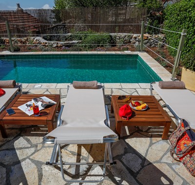 Unwind with friends and family on pool deck at Rosie's Herb Cottage, Assos, Kefalonia, Greek Islands