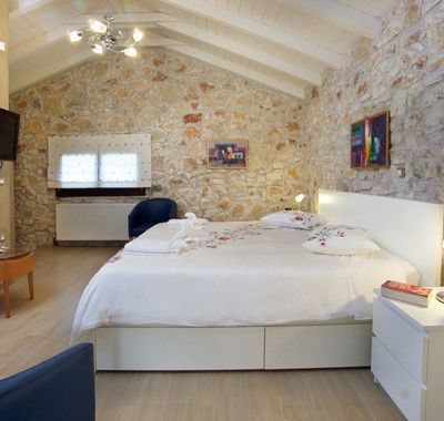 Gorgeous double bedroom with charming stone wall feature at Villa Theano, Sami, Kefalonia, Greek Islands