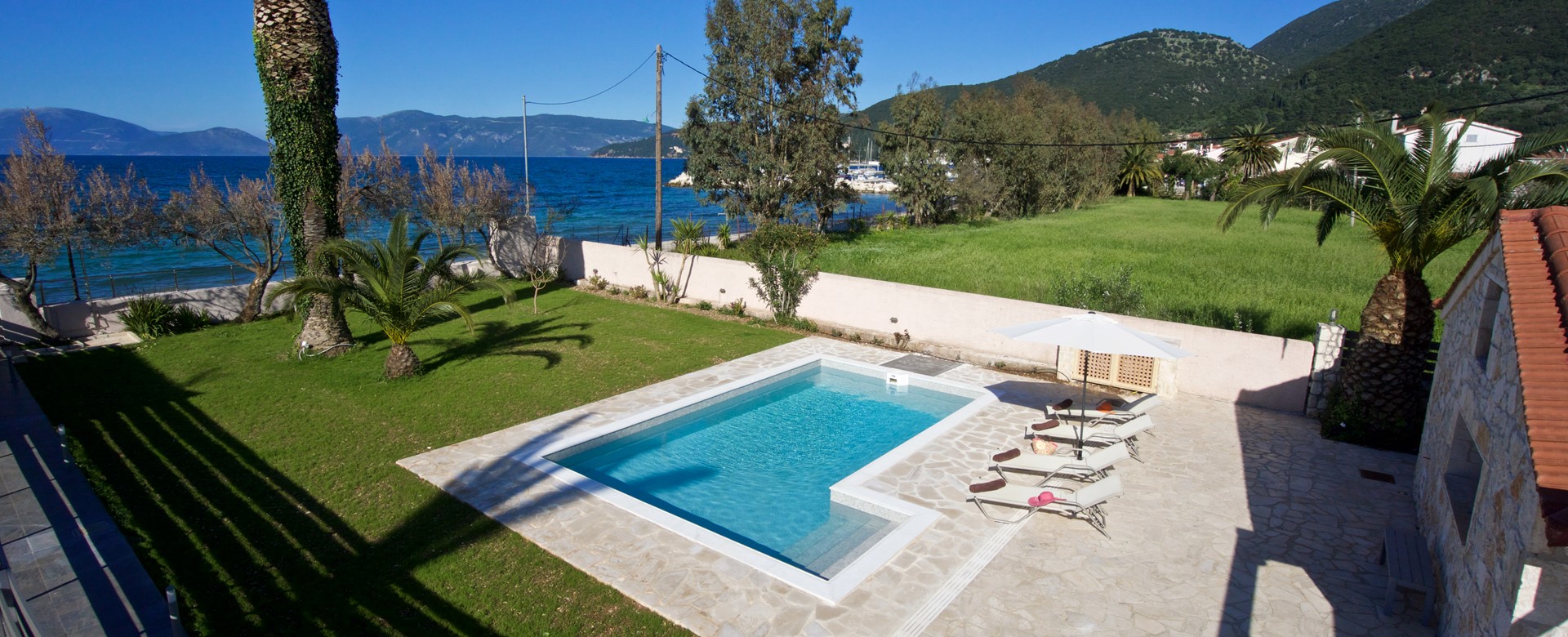 Aerial view over private pool towards beaches at Villa Theano, Sami, Kefalonia, Greek Islands