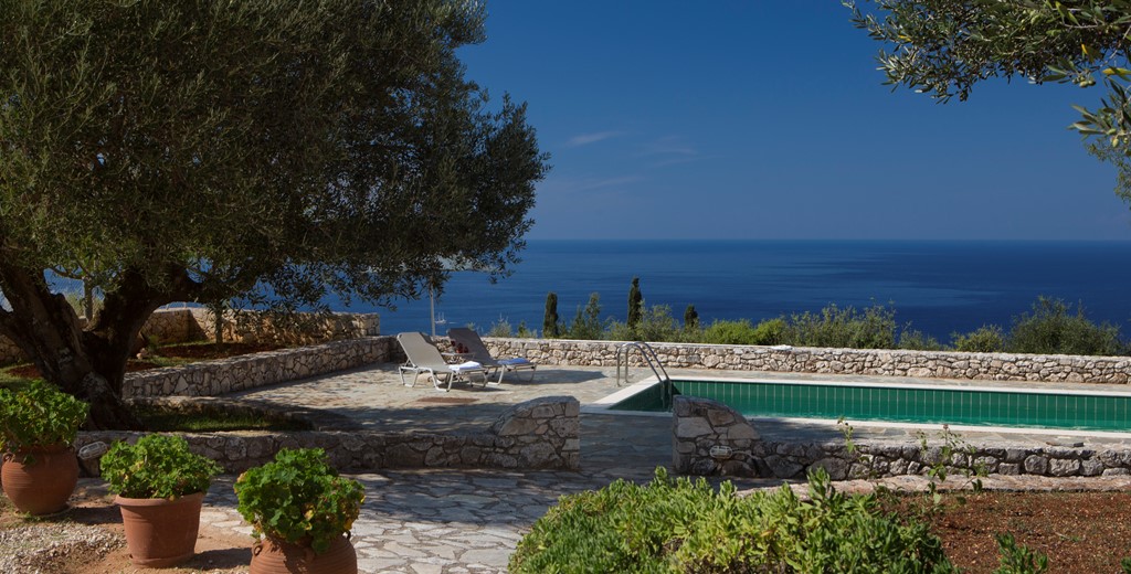 Pool, garden and sea views outside Lemoni Cottage, Fiscardo, Kefalonia