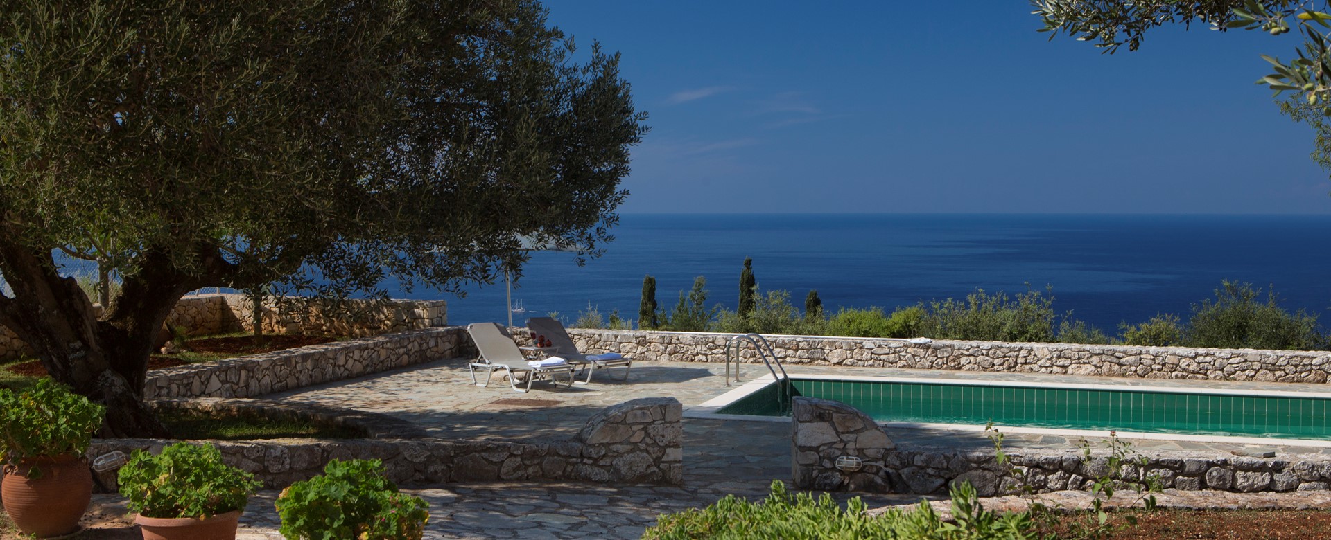 Pool, garden and sea views outside Lemoni Cottage, Fiscardo, Kefalonia